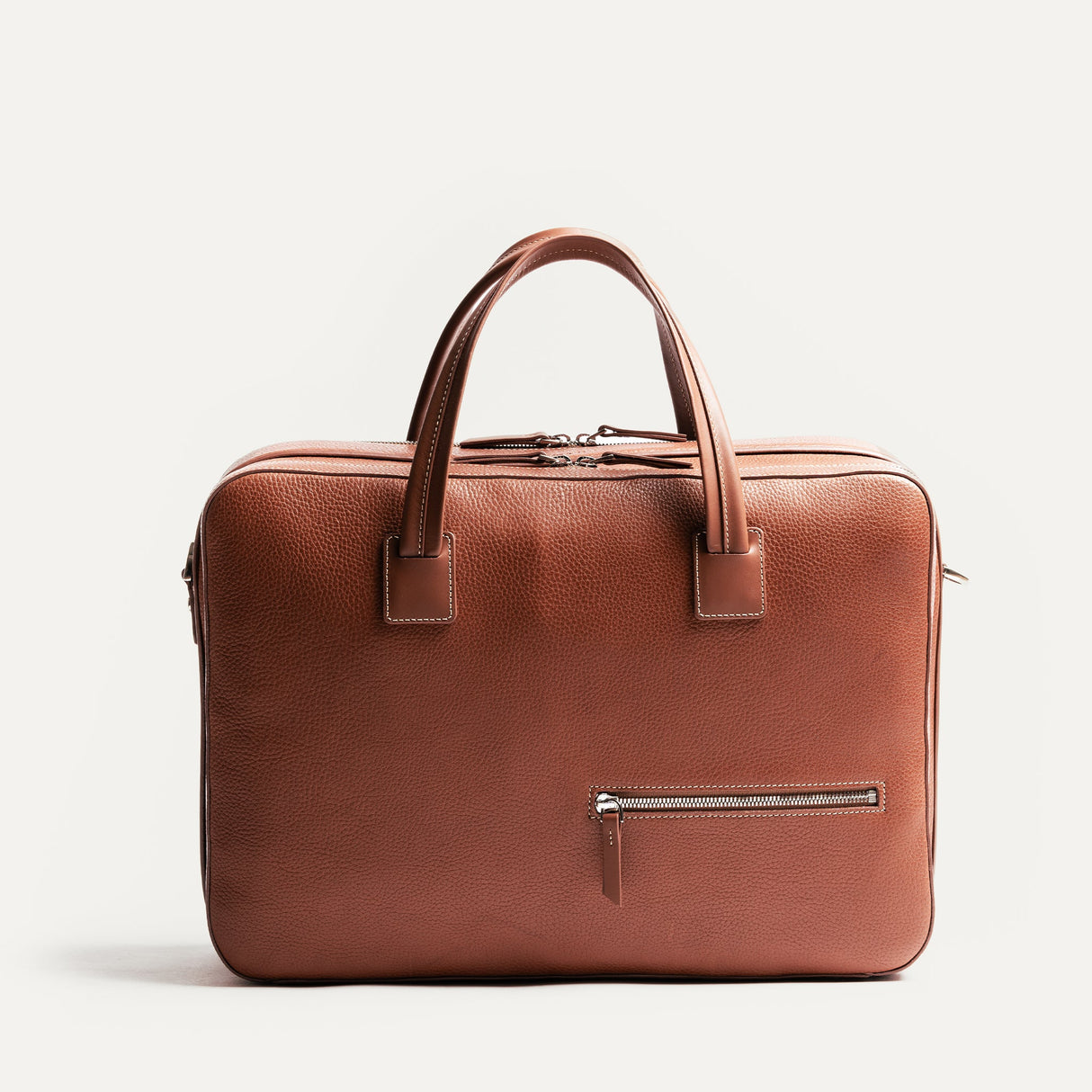 https://www.lundi-paris.com/cdn/shop/files/TIL3-sac-ordinateur-de-voyage-Tilio-en-cuir-pour-homme-cognac-10.jpg